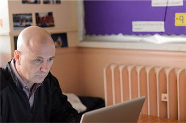 A psychologist working at a desk